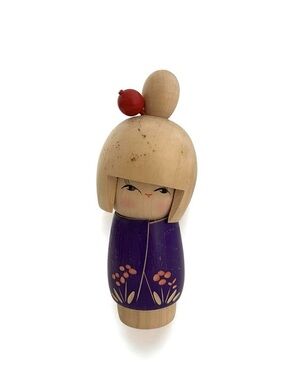 Wooden Kokeshi Doll with Purple Floral Kimono and Red Hair Ornament
